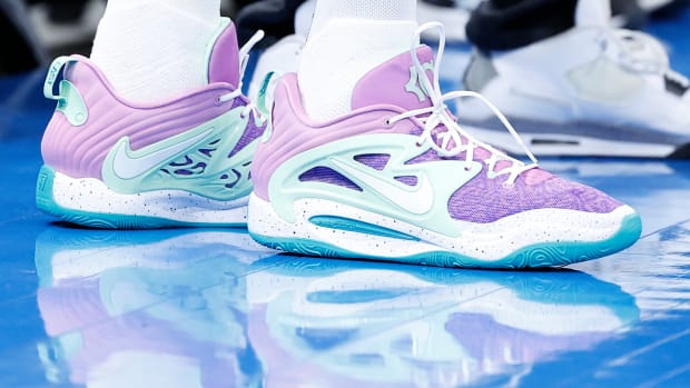 View of Kevin Durant's purple and white Nike shoes.